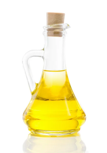 Glass jug with vegetable oil — Stock Photo, Image