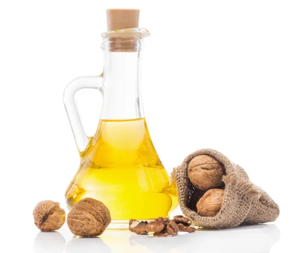 Walnut oil in a glass transparent bottle — Stock Photo, Image