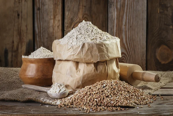 Buckwheat flour  on the old wooden background closeup — Stock Photo, Image