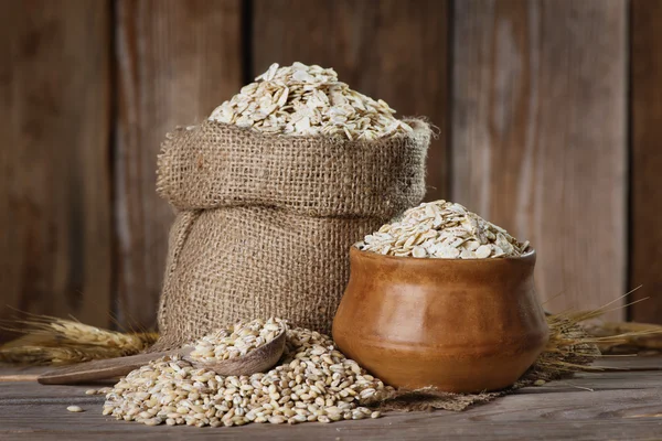 Barley  flakes in the bag — Stock Photo, Image