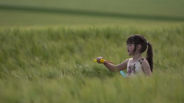 Little Girl in Makes Bubbles — Stock Video