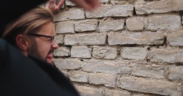 Businessman hitting brick wall and shouting — Stock Video
