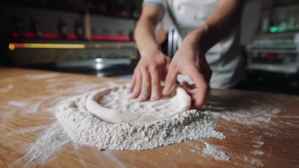 Close up of male hands making round form of dough — Stock Video