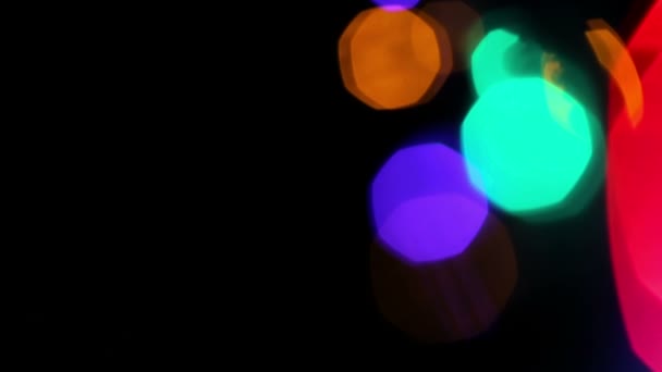Colored lights bokeh on black — Stock Video