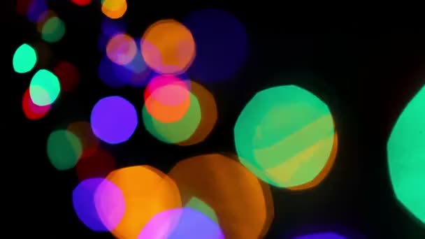 Luzes coloridas bokeh em preto — Vídeo de Stock