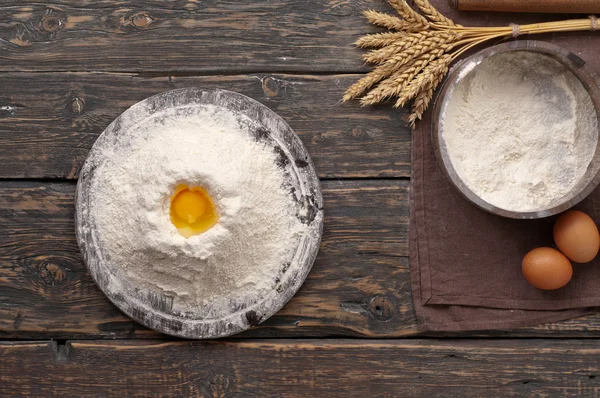 Handful of flour with egg yolk — Stock Photo, Image