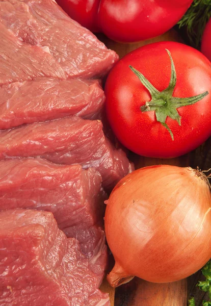 Closeup fresh raw beef with vegetables — Stock Photo, Image