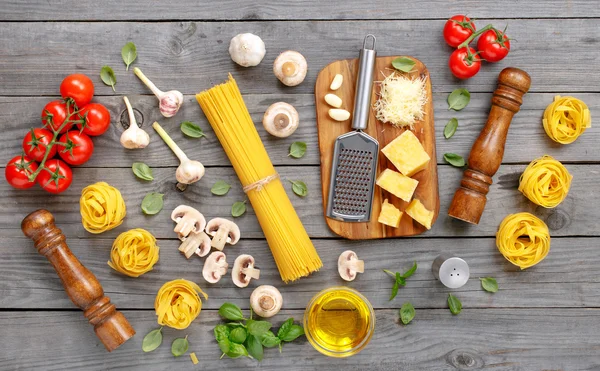 Spaghetti and fettuccine with different ingredients for cooking