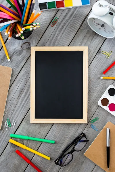 Small chalkboard in the frame school supplies — Stock Photo, Image