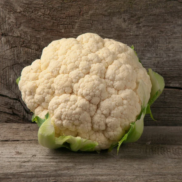 Raw cauliflower on wooden background — Stock Image Raw cauliflower on wooden background Royalty Free Stock Images