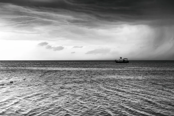 Boat on the background of cloudy sky before the storm Stock Picture