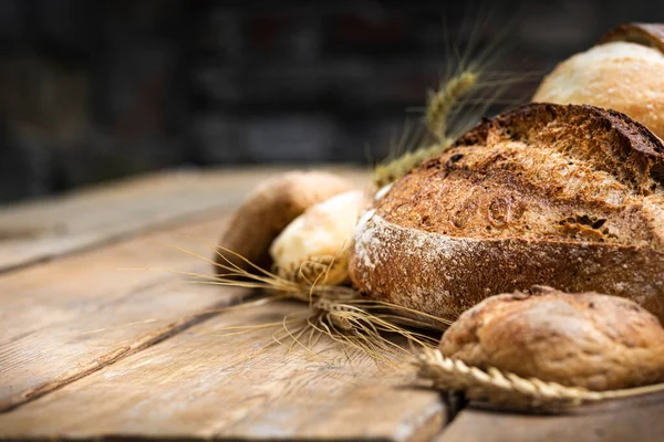 Assortment Different Types Bread Rye Wheat Flour Wooden Table Bakery — Zdjęcie stockowe