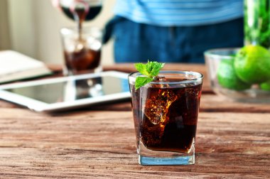 glass of cola with ice and mint  clipart