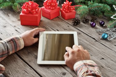 Tablet computer in men hands closeup