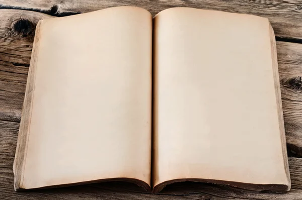 Detailed vintage notepad close up on a wooden table — ストック写真