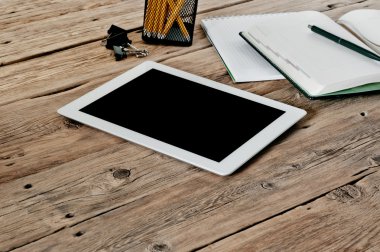 tablet computer with a blank screen on the office desk