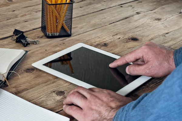 man clicks on the blank screen tablet computer