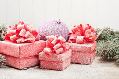 Christmas Present closeup with a toy in the snow