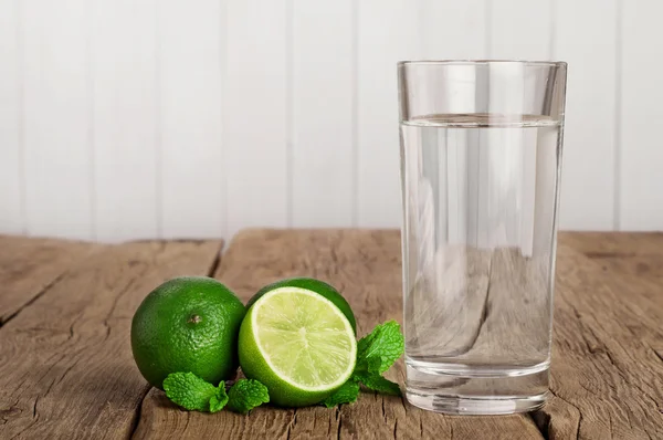 Glass of water with lime and mint — Stock Photo, Image