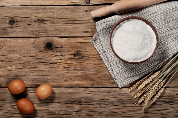 Flour, in a clay bowl with brown eggs — Stok fotoğraf