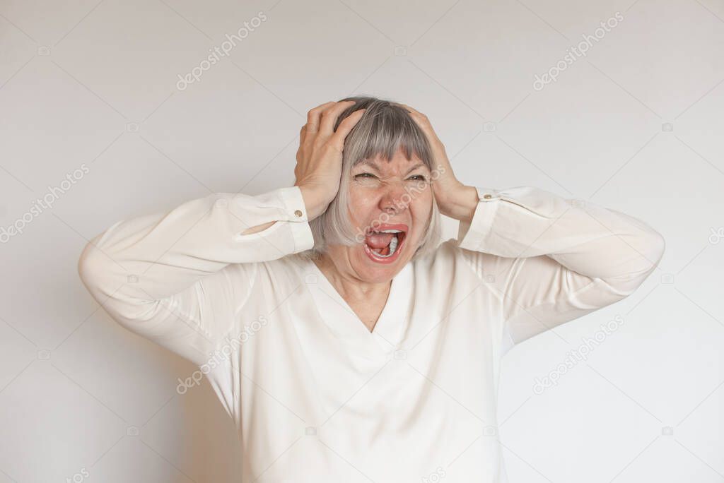 Stressed mature woman. Screams from depression, panic attack, violence, migraine, psychological health, climax, despair, dizziness, migraine, emotional anxiety Tired lady loneliness and pain concept
