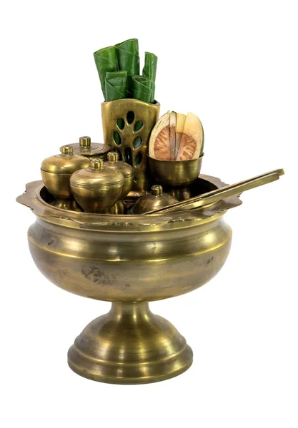 Brass bowl containing betel leaves and areca nuts — Stock Photo, Image