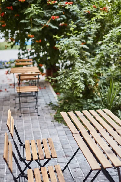 stock image table and chairs on the terrace empty street cafe with garden