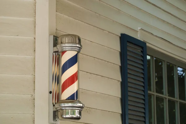 Stock image Barber pole on side of Barber Shop