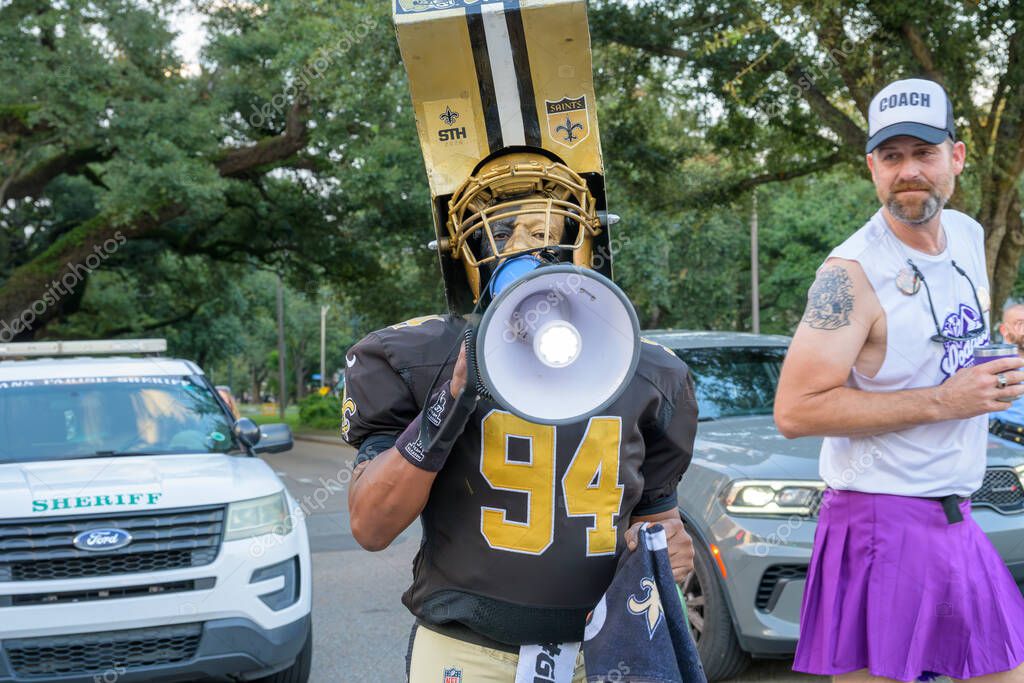 New Orleans, LA, USA - August 23, 2025: New Orleans Saints superfan known as Whistle Monsta gets on the bullhorn in the Midsummer Mardi Gras Parade at the corner of Oak Street and Carrollton Avenue