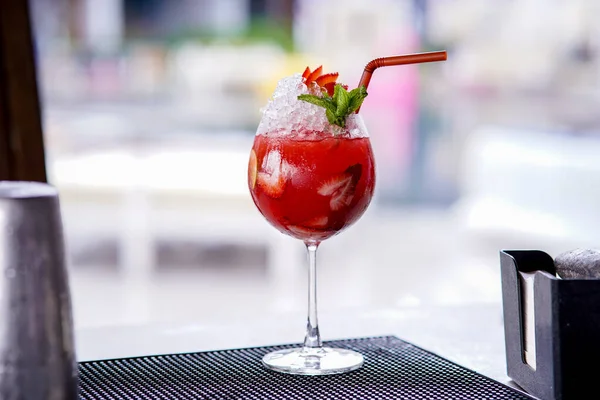 Strawberry Daiquiri Cocktail with plastic straw, cocktail in the bar