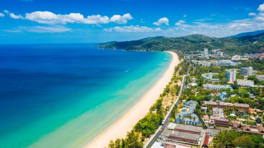 Aerial view of the sunny beach with white sand and turquoise sea with hotels on the beach line. Summer vacation and nature travel adventure concept.. Summer composition. High quality photo