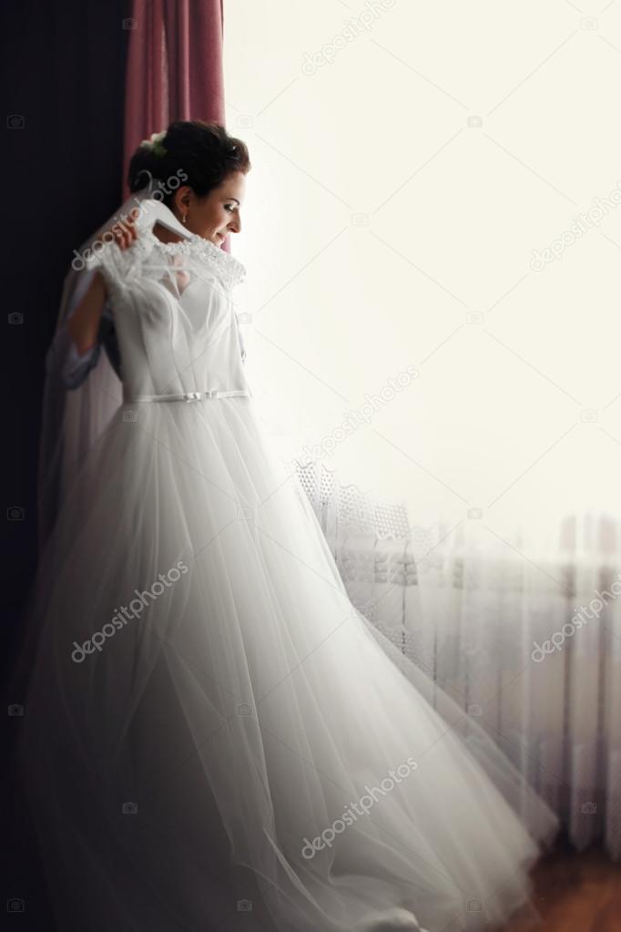Beautiful brunette bride with dress
