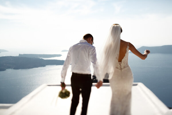 Handsome happy groom and bride