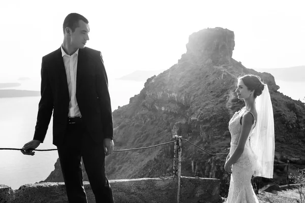 Happy bride and groom looking — Stock Photo, Image