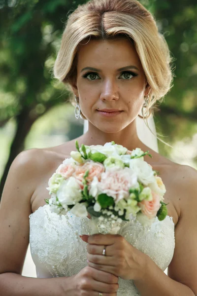 Beautiful blonde bride in white dress — Stock Photo, Image