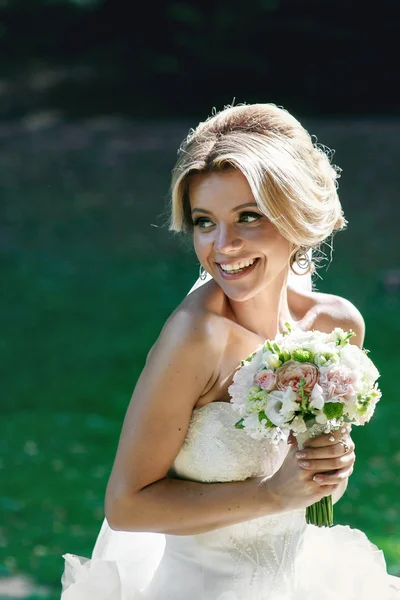 Beautiful emotional blonde bride — Stock Photo, Image