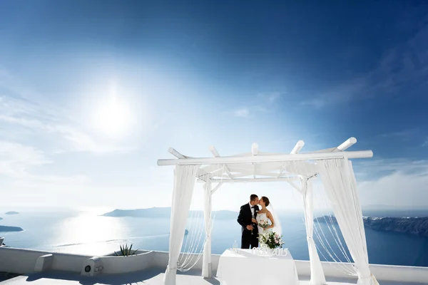 Happy married couple kissing on terrace — Stock Photo, Image