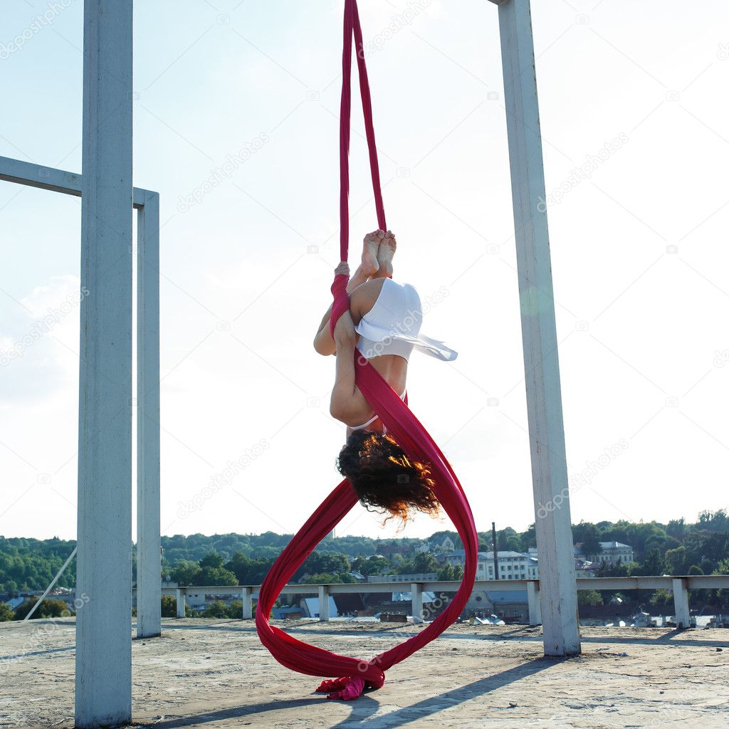 Aerial dancer on rooftop