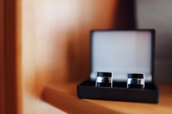 Black cufflinks in the box, bowtie — Stock Photo, Image