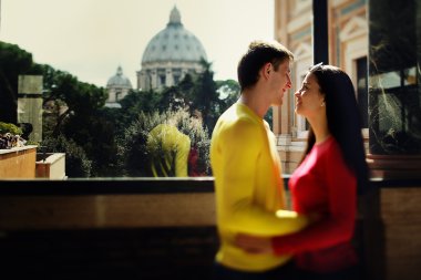 couple on the background of the dome of St. Peter the trees