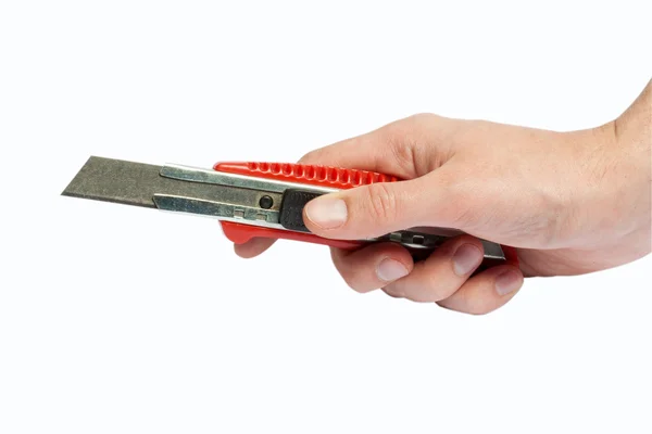 Hand with cutter — Stock Photo, Image