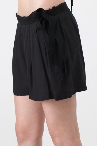 Woman in black shorts — Stock Photo, Image