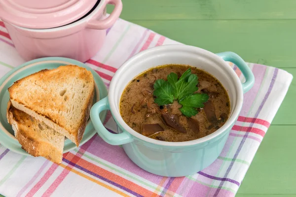 Two mini casseroles of mushroom soup with grilled toast — Stock Photo, Image