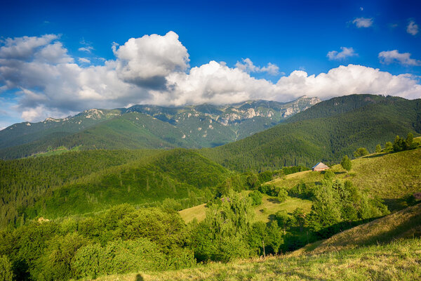 Evening and sunset on mountain hills of Simon village. Bran.