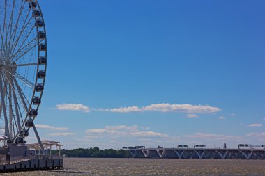 National Harbor Ferris wheel and Woodrow Wilson Memorial Bridge. clipart