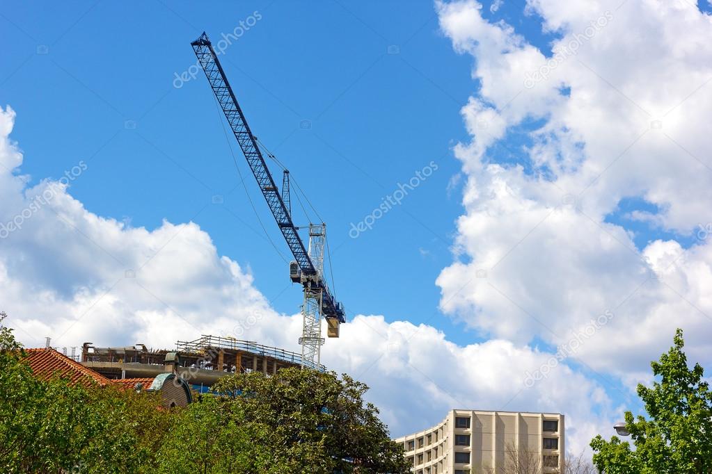 Blue construction crane in the city.