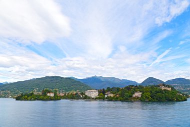 Panoramic view on mountains and towns on the Lake Maggiore in summer.