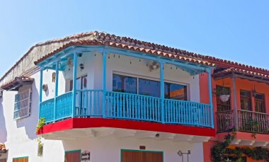 House with a blue balcony in Cartagena city, Columbia. clipart