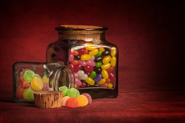 Glas gefüllt mit Bonbons Stockbild