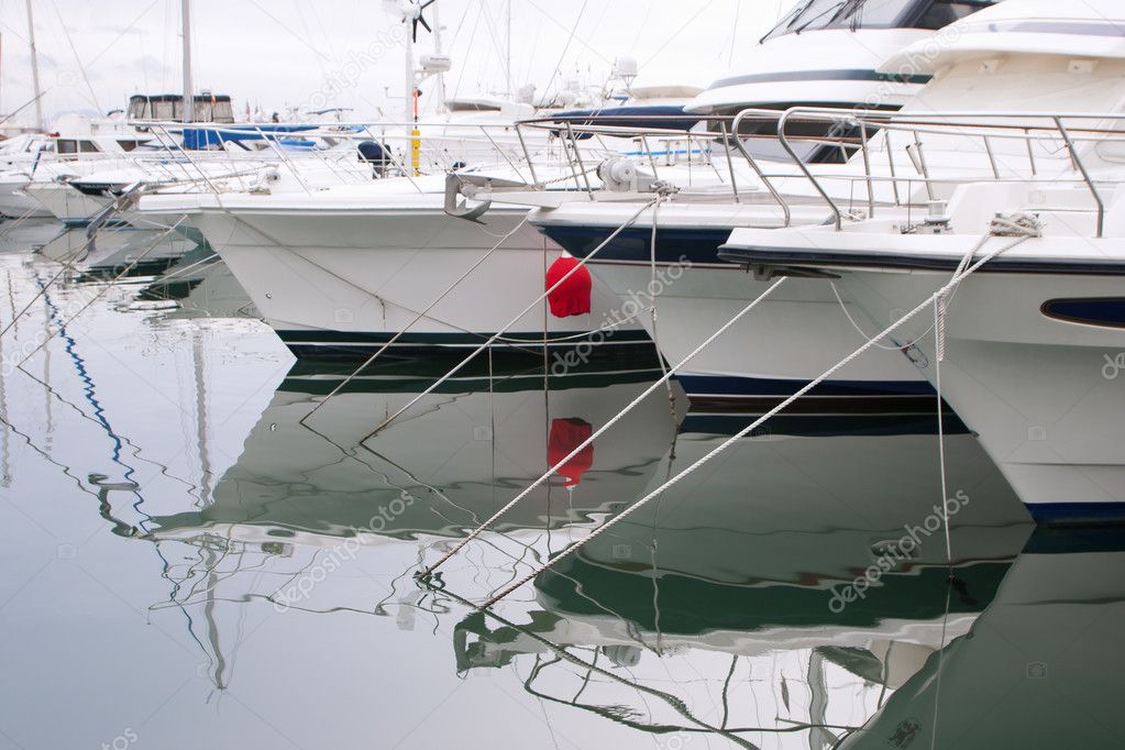 White boats and yachts in the quay